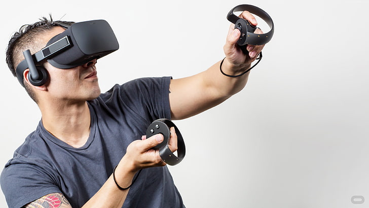 A man using Virtual reality (VR) headset and controllers