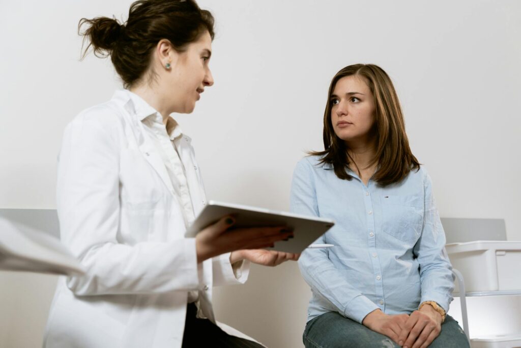 a pregnant lady consulting her healthcare provider